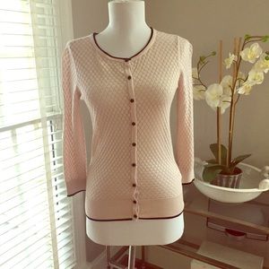 Beige sweater with black trim