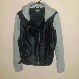 Jacket pleather with grey sleeves.
