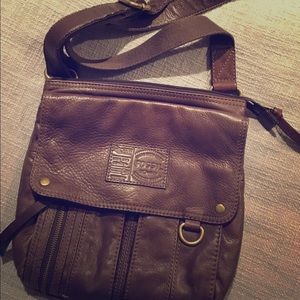 Fossil cross-body/ shoulder leather purse.