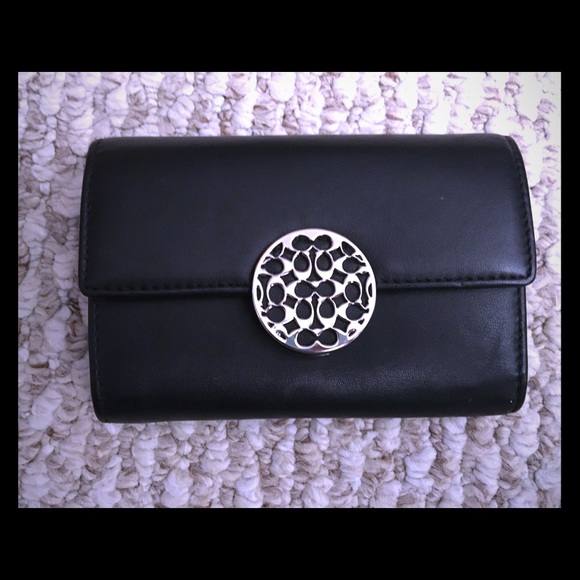 Black and silver Coach wallet