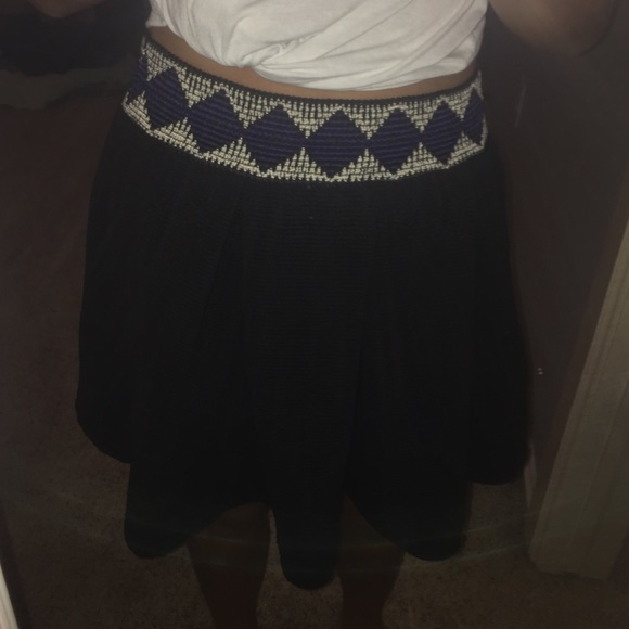 Black skirt w/ white and blue embroidering