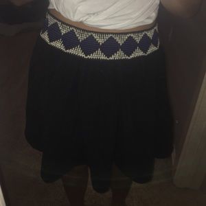Black skirt w/ white and blue embroidering