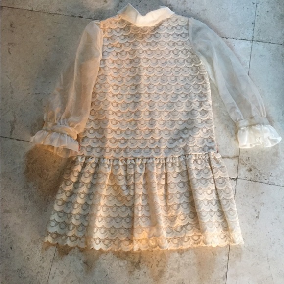 Lace mini dress with peplum and sheer sleeves