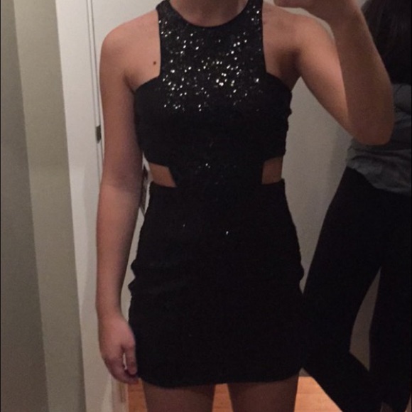 Black sequin side cut out dress.