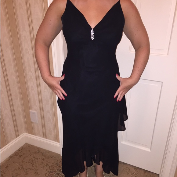 Black high-low ruffled gown with jeweled accent
