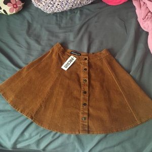 Brandy Melville tan button skirt
