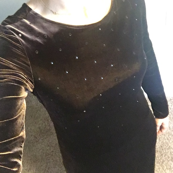 Long sleeved dress. Rhine stone detail. Open back