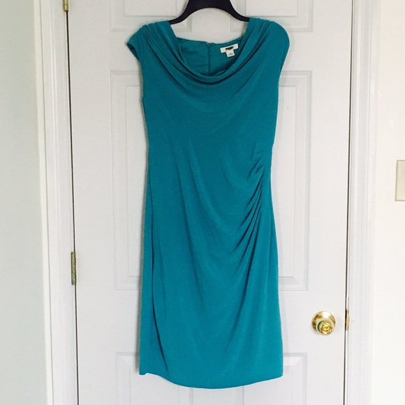Blue dress with ruffle on side. Shape forming