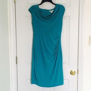 Blue dress with ruffle on side. Shape forming