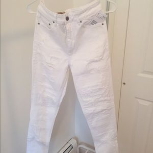 White distressed denim jeans.
