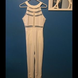 pants jump suit. It is white with mesh sections.