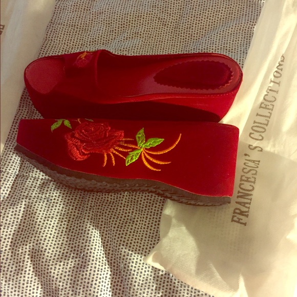 A beautiful flower suede wedge sandal.