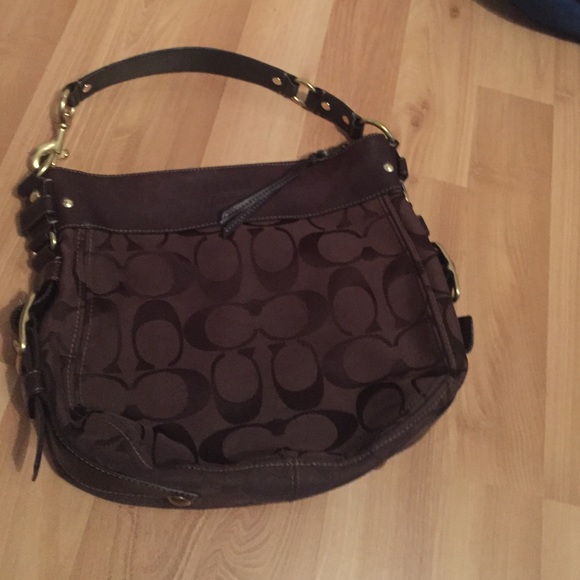 Large brown coach shoulder bag.