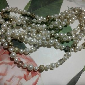 Long simulated pearl necklace