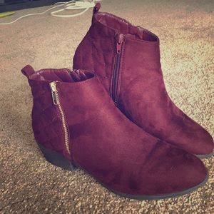Burgundy zipper booties.