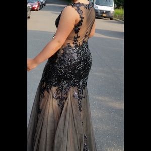 Top of the line, beautiful black evening gown.