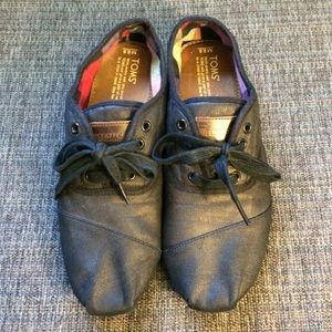 A lightly used pair of Toms