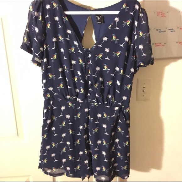 Blue romper with bird and tropical details