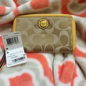 Small yellow coach wristlet
