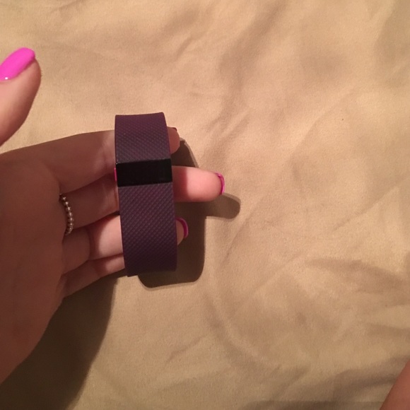 Purple FitBit Charge HR.