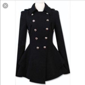 Black military coat with skirt hem.