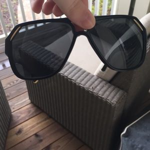 Black and gold Dolce and Gabana sunglasses.