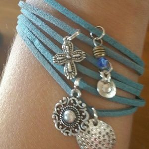 Hand crafted teal and charmed bracelet.