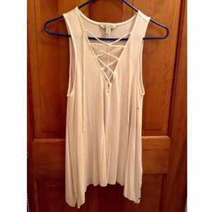 White tank with crossed ties on the bust