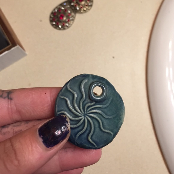Clay molded pendant