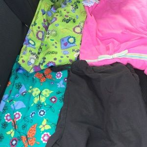 Three small scrub tops one small scrub pants
