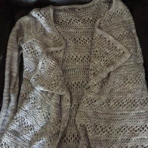 Light grey sweater with holes barely worn