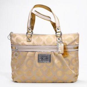 Coach gold women's purse.