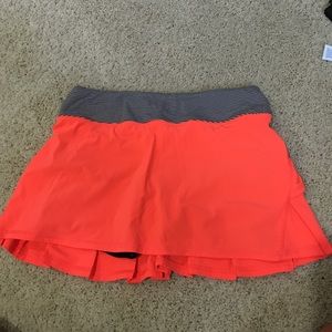 bright coral tennis skirt