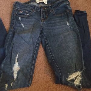 Medium wash distressed Hollister skinny jeans.