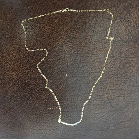 Gold necklace with clear beading.