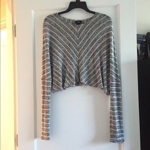 Long sleeve striped grey and white sweater.
