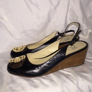 Black wedge shoe with good embellishment.