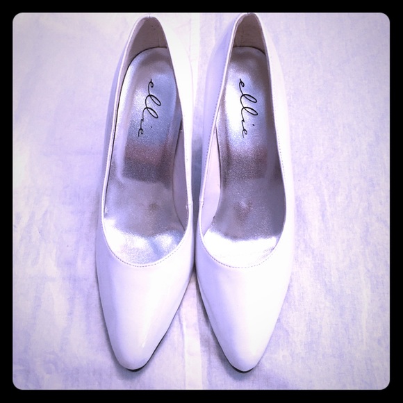 White pointed toe pumps