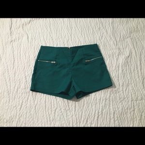 Teal shorts.