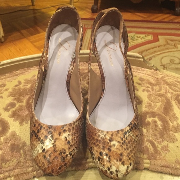 Delman snakeskin pumps