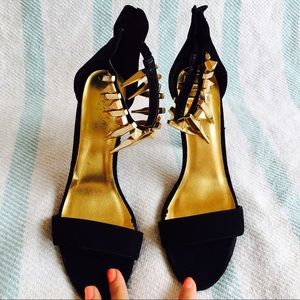 Gold spike ankle strap black heels with zip back