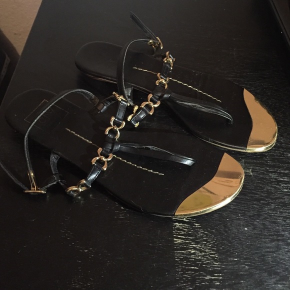 Black and gold flat sandals. Dolce Vita.