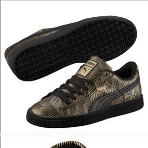 Black and gold puma shoes
