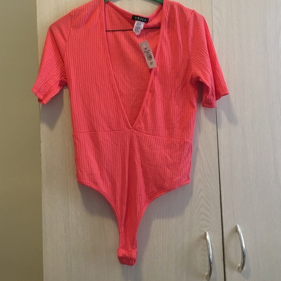 Coral body suit.
