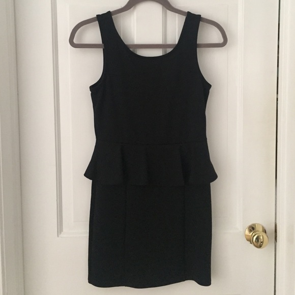 Peplum dress with zipper back and seams on skirt
