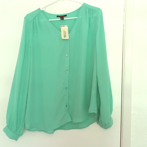 Long sleeve mint colored blouse.
