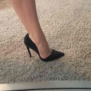 Black pointed toe pumps