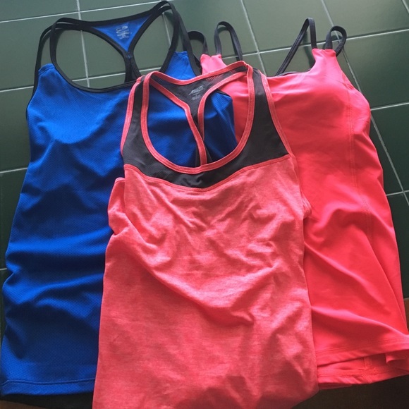 Three assorted workout tank tops