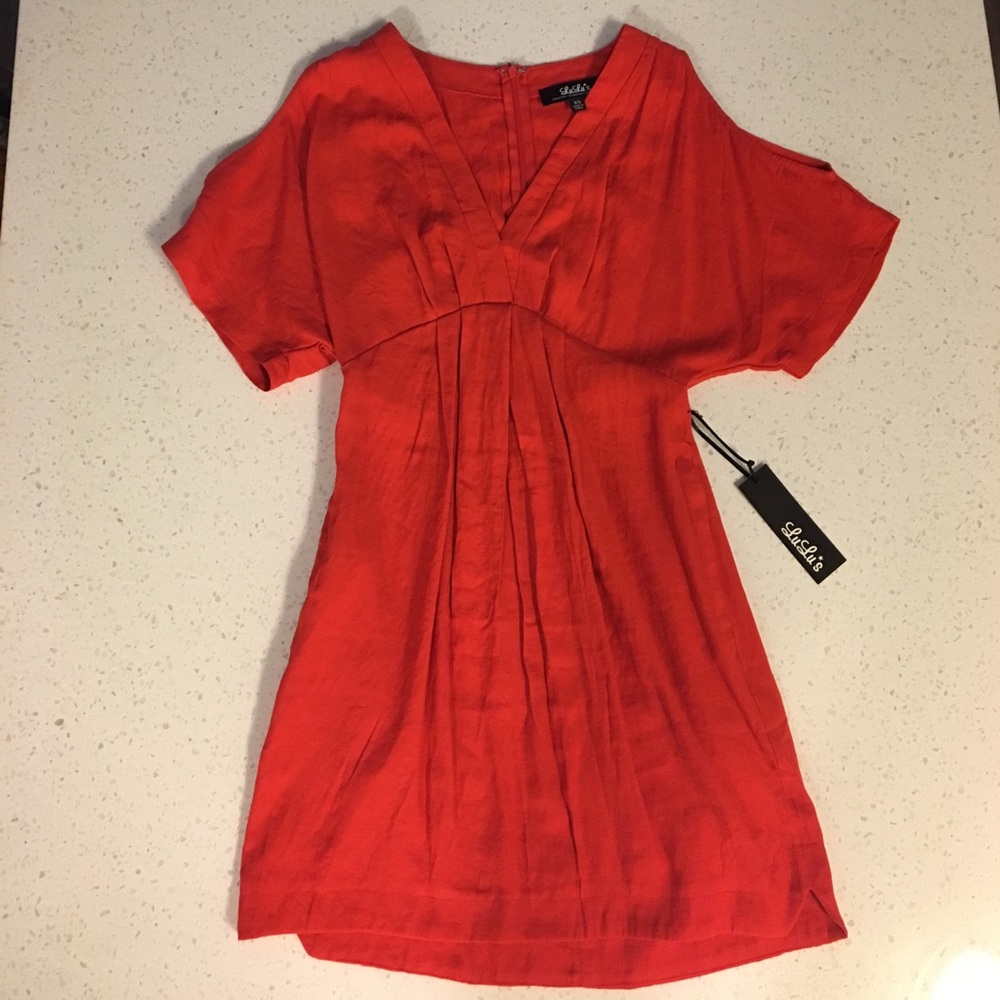 NWT cold shoulder dress! 68% rayon, 32% polyester.