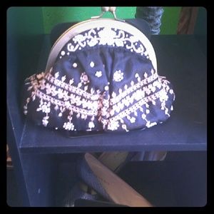 Valerie Stevens clutch with strap